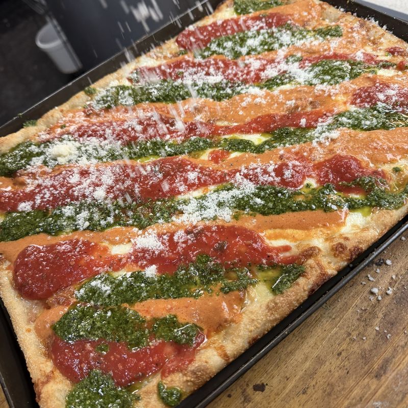 MVP square pie with stripes of pesto, vodka and red sauce